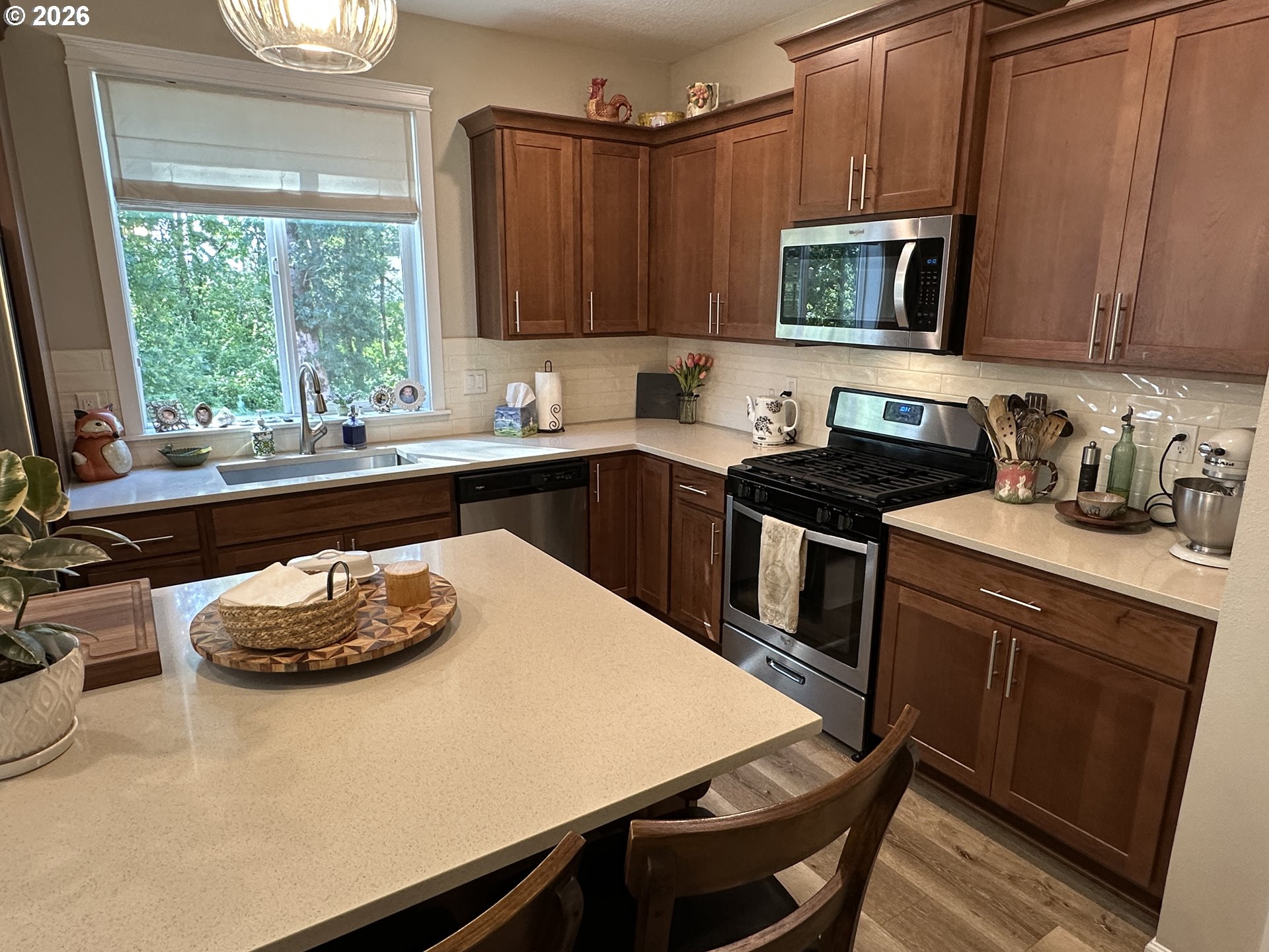 59290 Forest Trail Circle St. Helens, OR 97051 - Photo 12 of 33 a kitchen with a sink stove and microwave