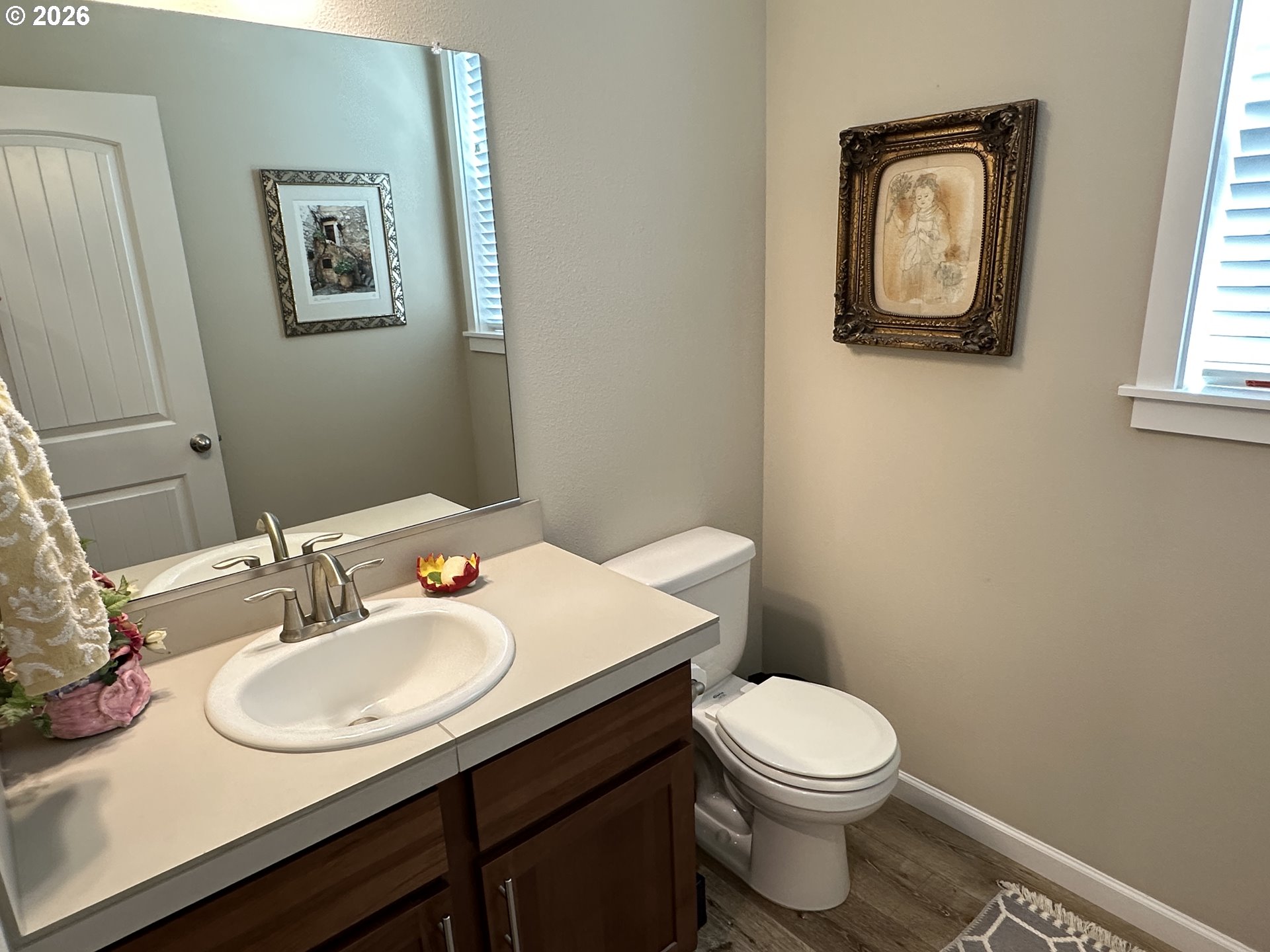 59290 Forest Trail Circle St. Helens, OR 97051 - Photo 14 of 33 a bathroom with a toilet a sink and mirror