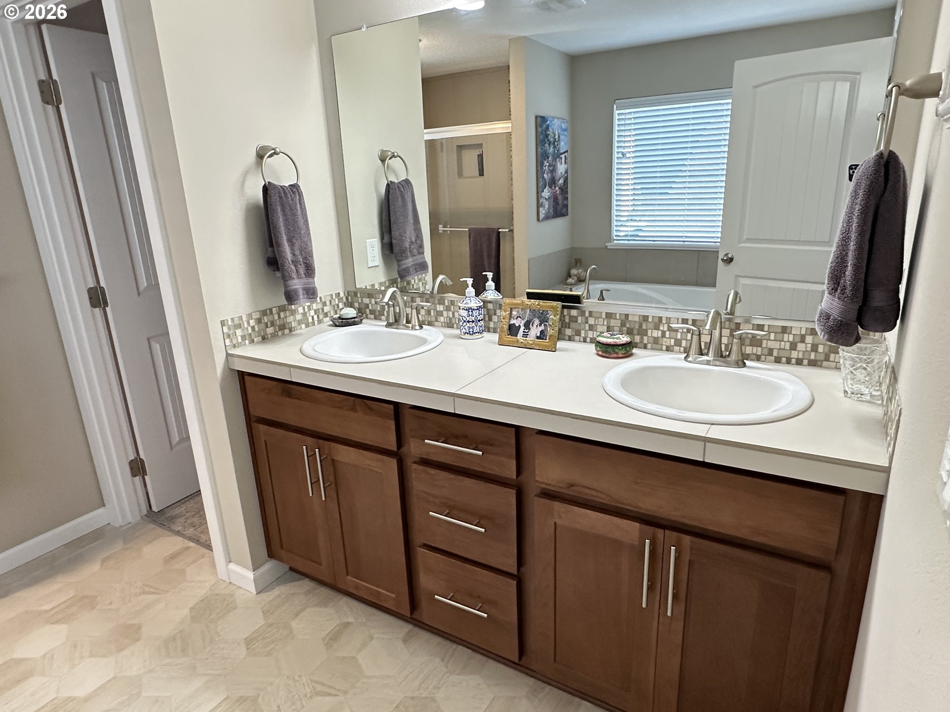 59290 Forest Trail Circle St. Helens, OR 97051 - Photo 19 of 33 a bathroom with a double vanity sink and a mirror