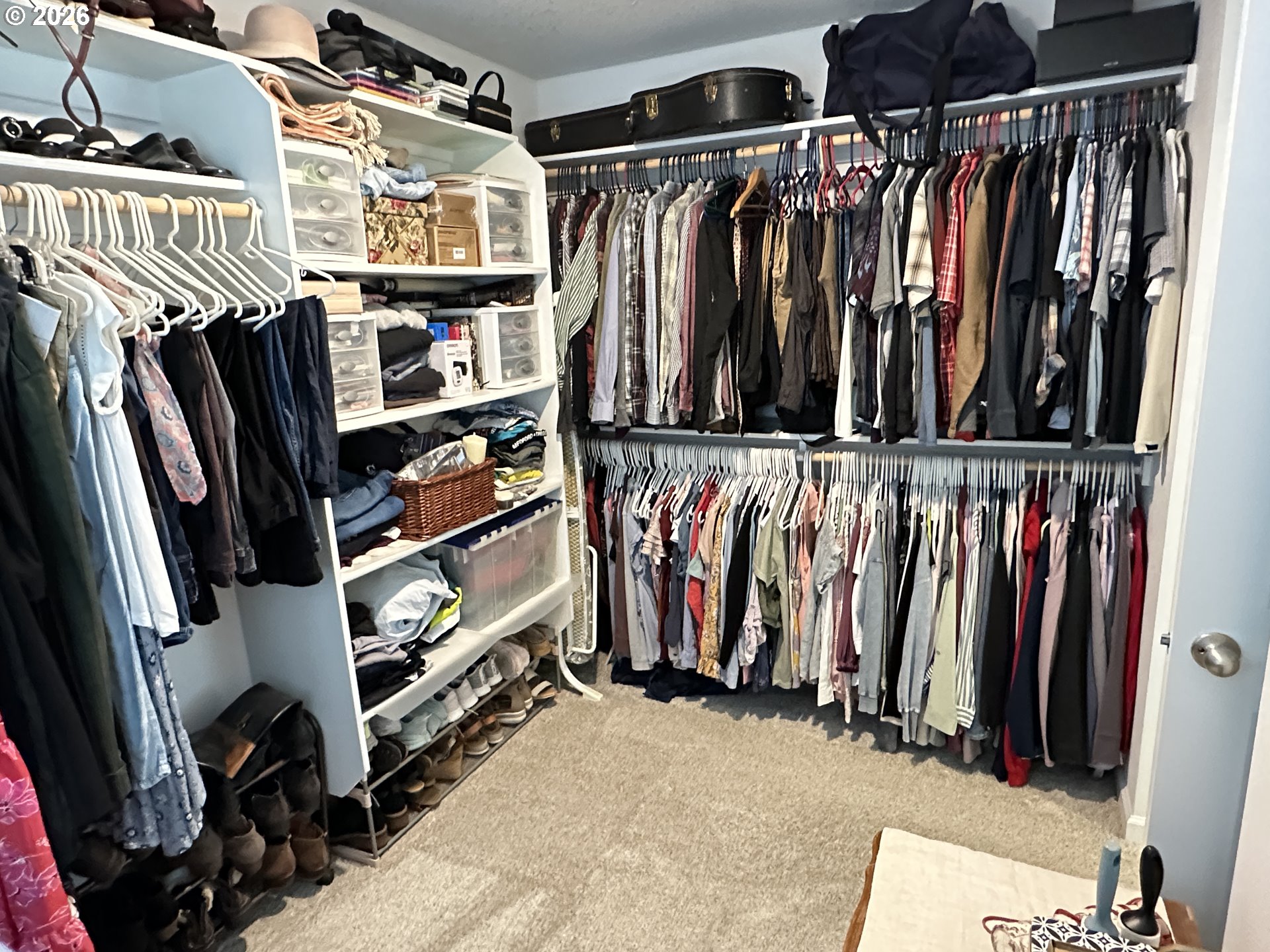 59290 Forest Trail Circle St. Helens, OR 97051 - Photo 21 of 33 a view of walk in closet with clothes and shoes