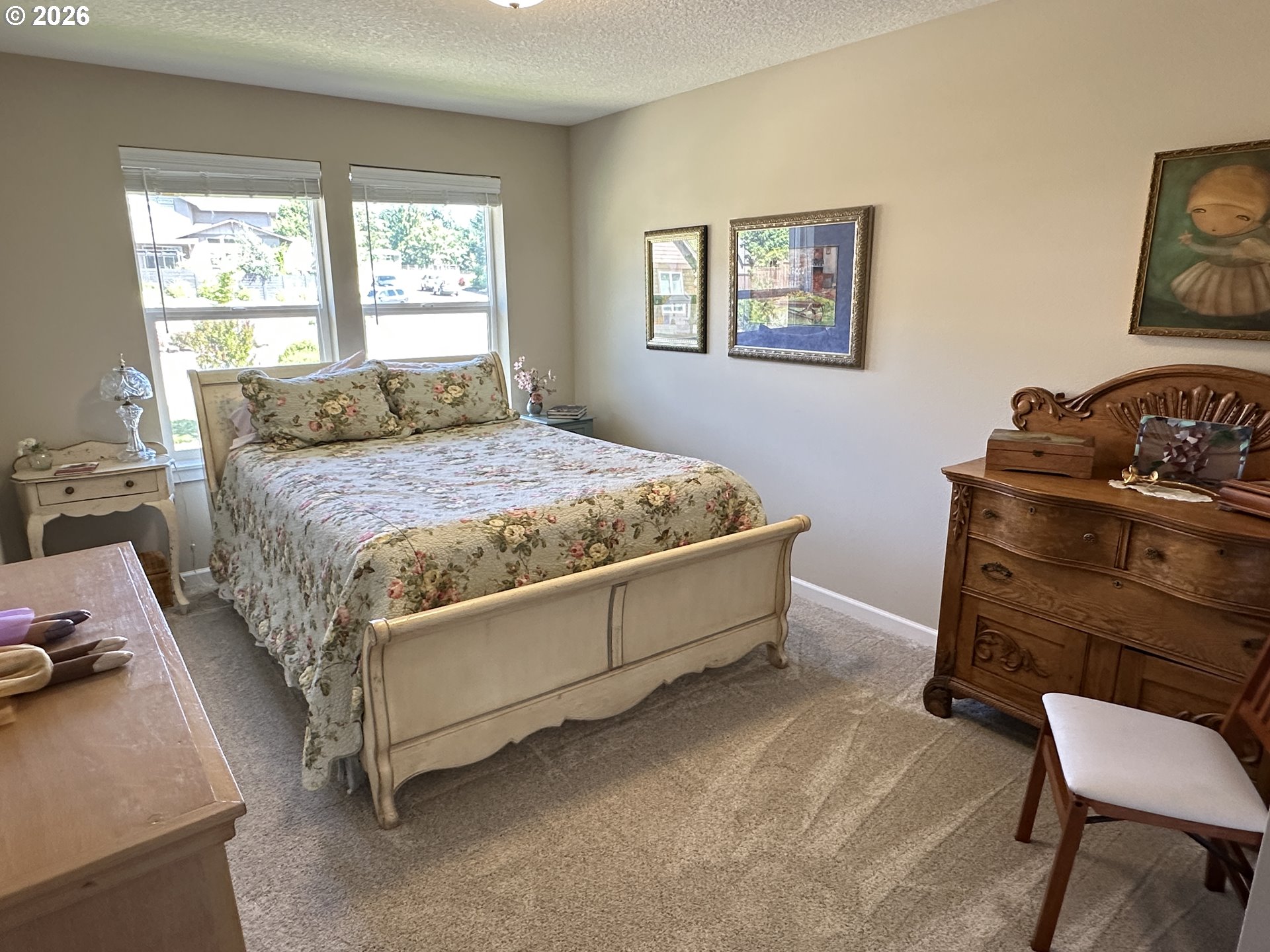 59290 Forest Trail Circle St. Helens, OR 97051 - Photo 25 of 33 a bed sitting in a bedroom next to a window