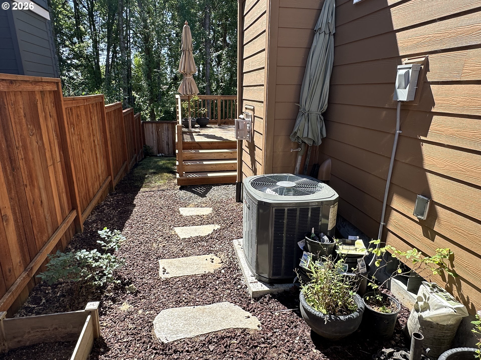 59290 Forest Trail Circle St. Helens, OR 97051 - Photo 31 of 33 a view of a porch with chairs and plants