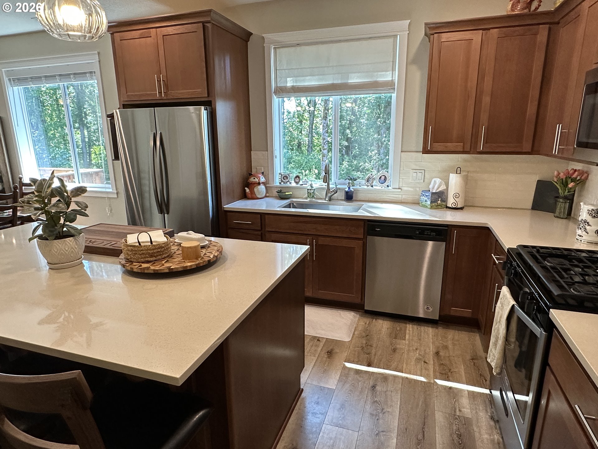 59290 Forest Trail Circle St. Helens, OR 97051 - Photo 10 of 33 a kitchen with stainless steel appliances a sink a counter space and a window