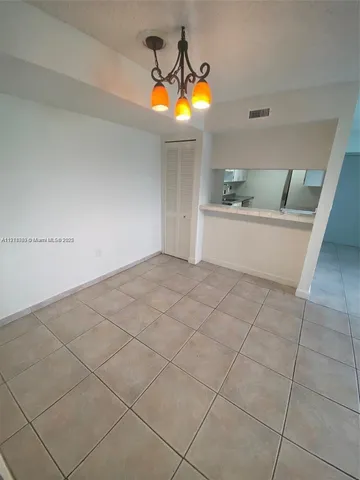 a view of a kitchen with granite countertop and a sink