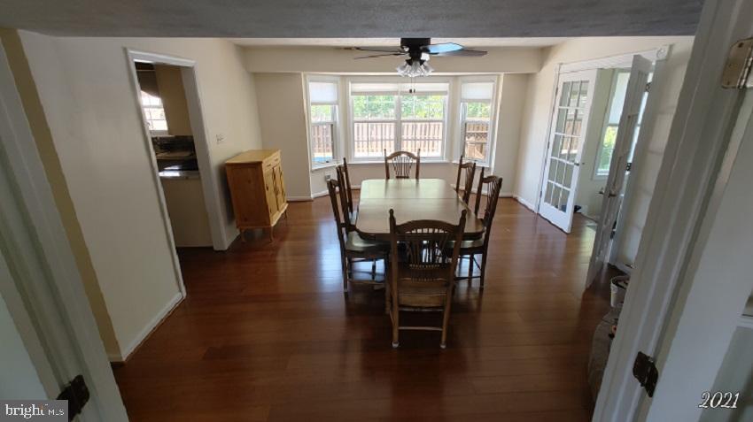 11905 Mill Bridge Road Lusby, MD 20657 - Photo 17 of 59 a view of a dining room with furniture window and outside view