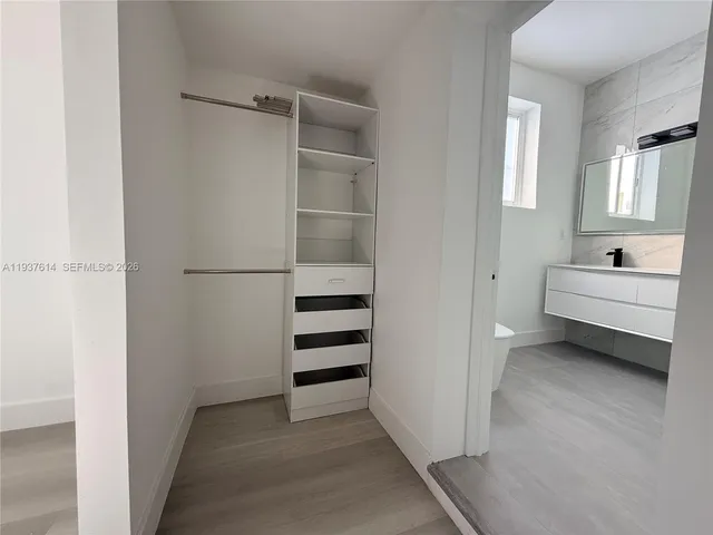 a view of a bedroom with closet area