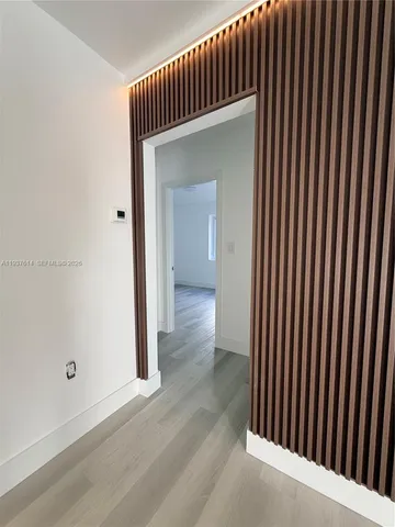 an entryway view with wooden floor