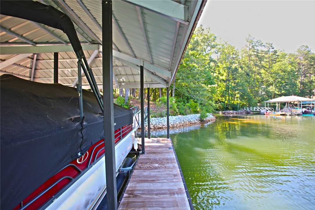 1359 Hbr Rdg Road Seneca, SC 29672 - Photo 25 of 39 A private boat dock provides direct lake access and sheltered mooring, nestled amongst lush woodlands.