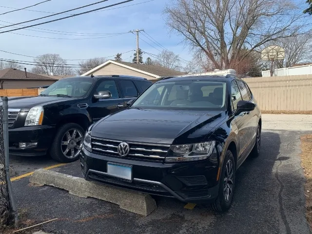 a car parked in front of a house