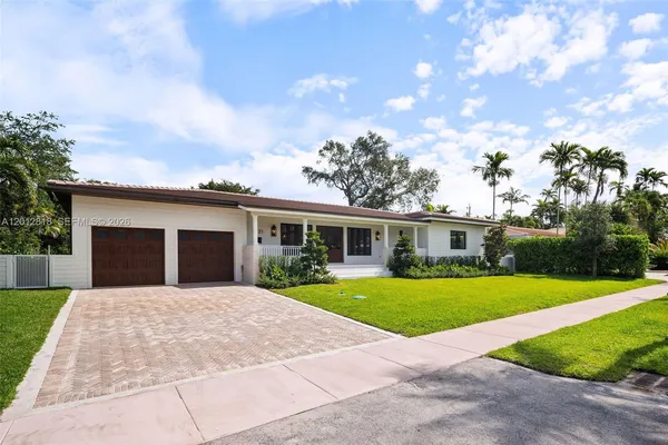 front view of a house with a yard