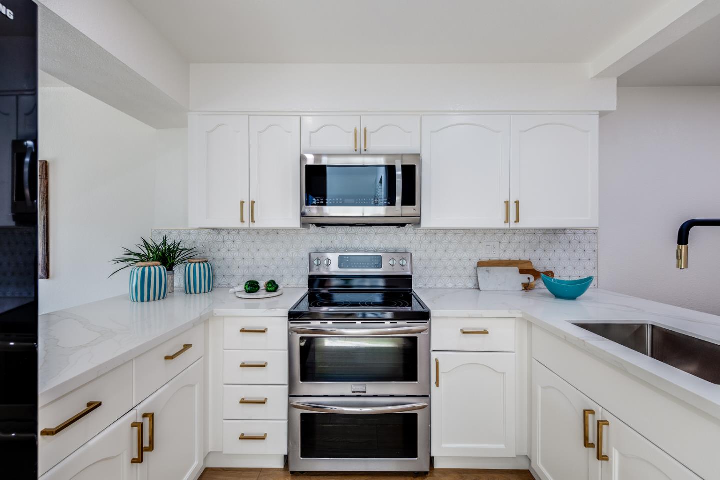 645 Sharp Park Road Pacifica, CA 94044 - Photo 12 of 34 a kitchen with cabinets stainless steel appliances and a counter space