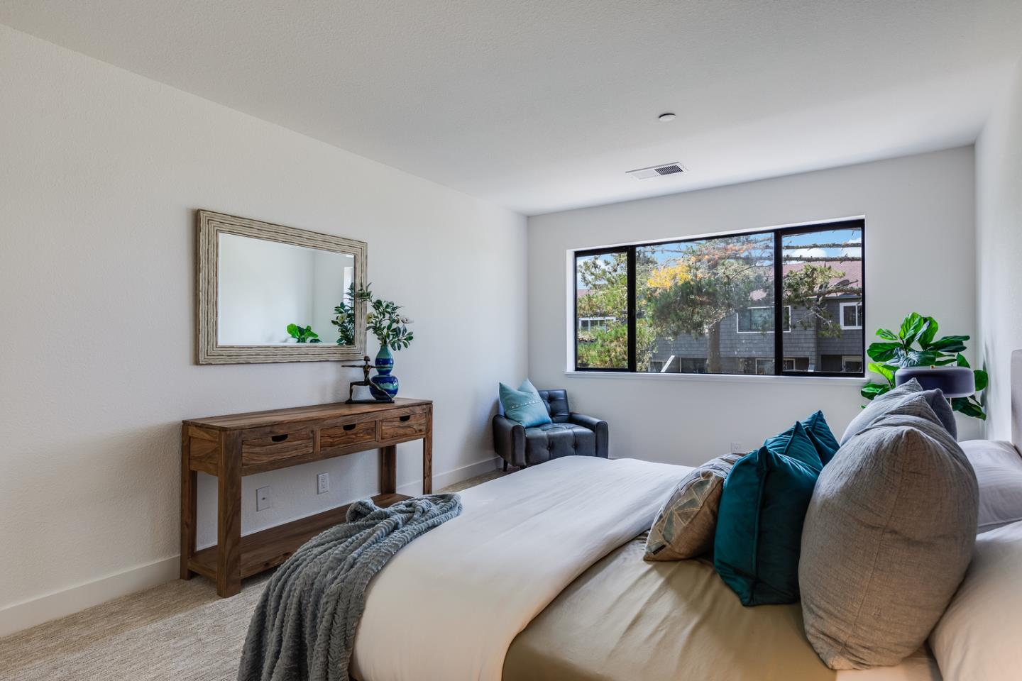 645 Sharp Park Road Pacifica, CA 94044 - Photo 20 of 34 a bedroom with a bed and a large window