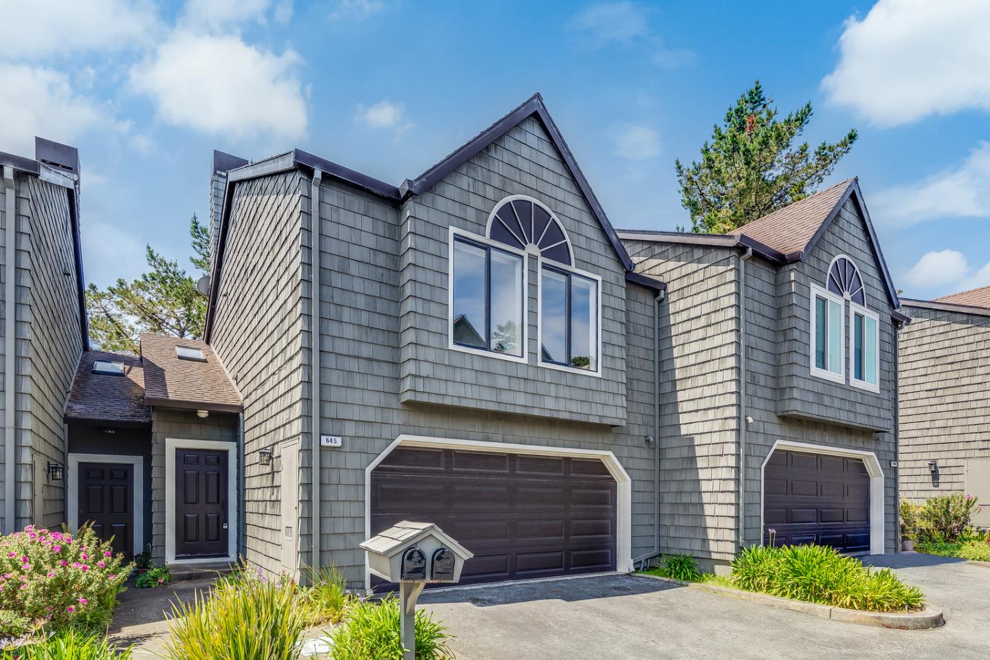 645 Sharp Park Road Pacifica, CA 94044 - Photo 2 of 34 a front view of a house with garden