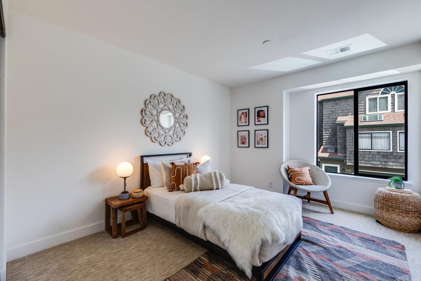 645 Sharp Park Road Pacifica, CA 94044 - Photo 23 of 34 a bedroom with a bed a table and chair