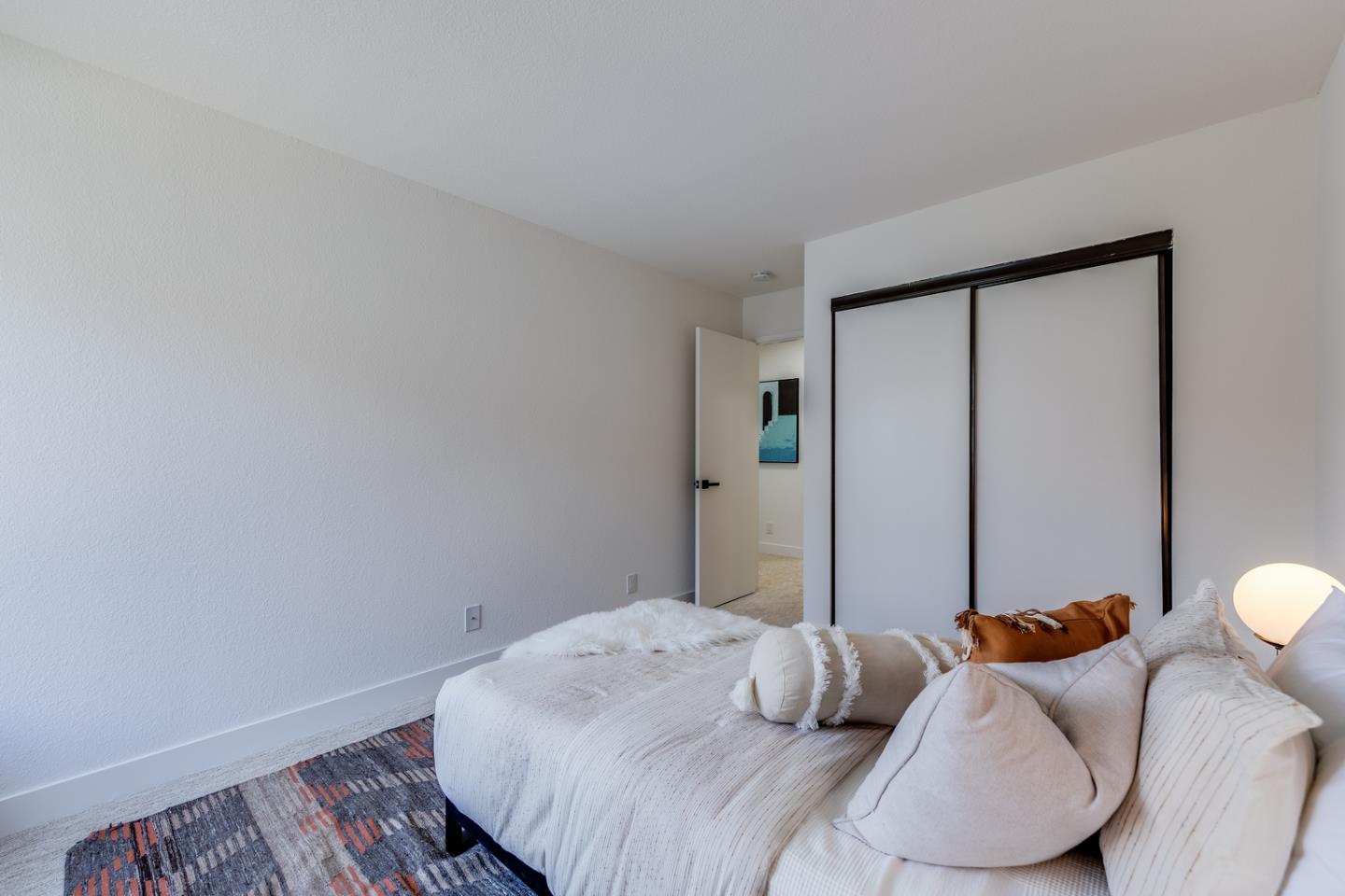 645 Sharp Park Road Pacifica, CA 94044 - Photo 24 of 34 a bedroom with a bed and a window