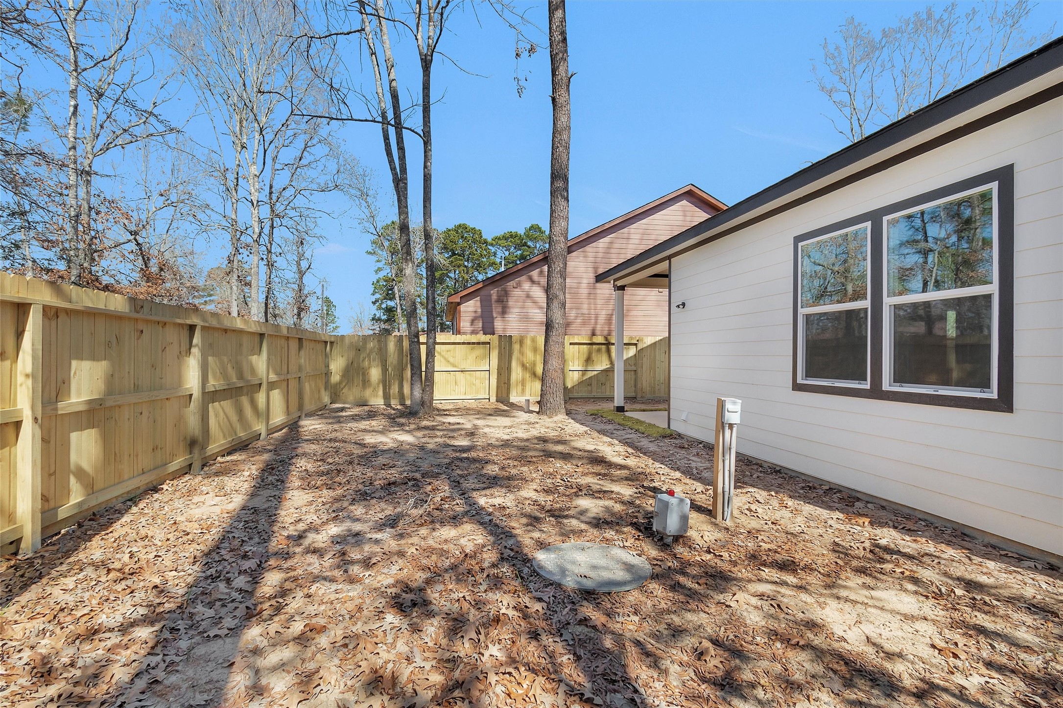105 Canary St Point Point Blank, TX 77364 - Photo 26 of 29 a front view of a house with a yard