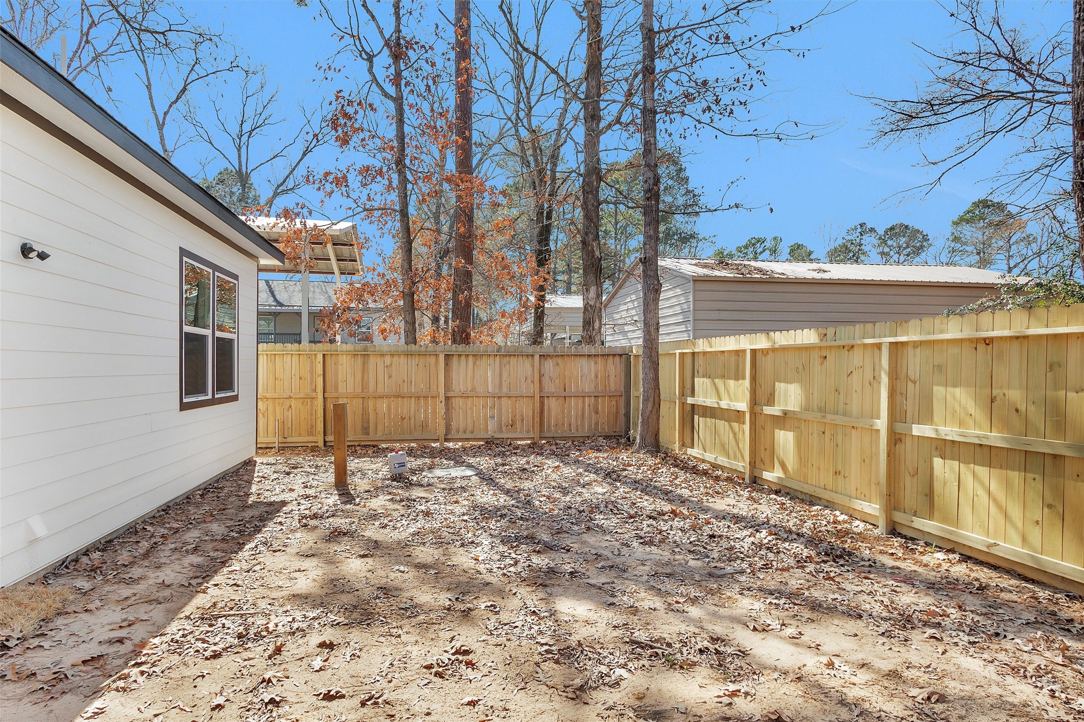 105 Canary St Point Point Blank, TX 77364 - Photo 29 of 29 a backyard of a house