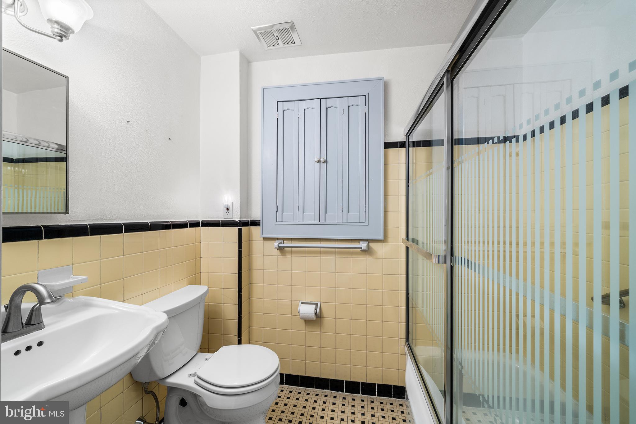 504 Lawrence Road Havertown, PA 19083 - Photo 11 of 20 a bathroom with a sink a toilet and shower