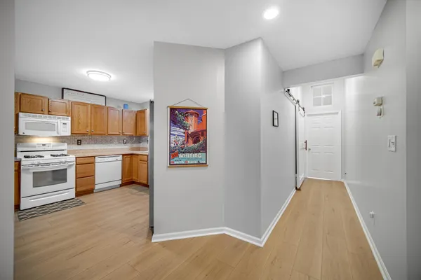 a kitchen with stainless steel appliances a refrigerator and a stove top oven
