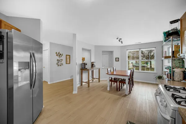 a view of a dining room with furniture window and wooden floor