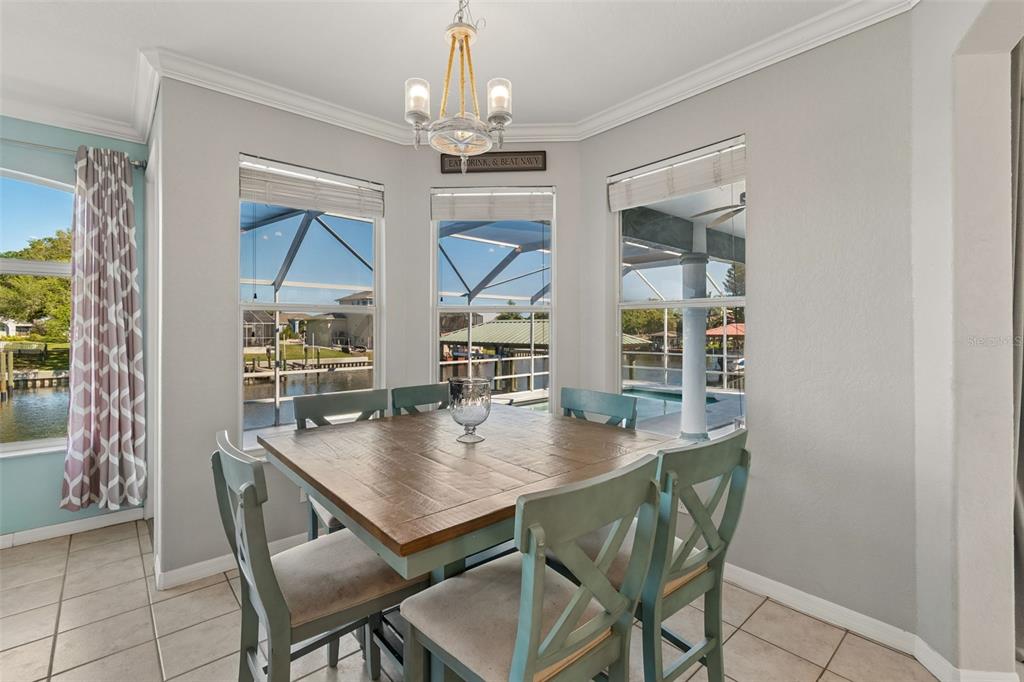 703 Bunker View Drive Apollo Beach, FL 33572 - Photo 17 of 49 a view of a dining room with furniture and wooden floor