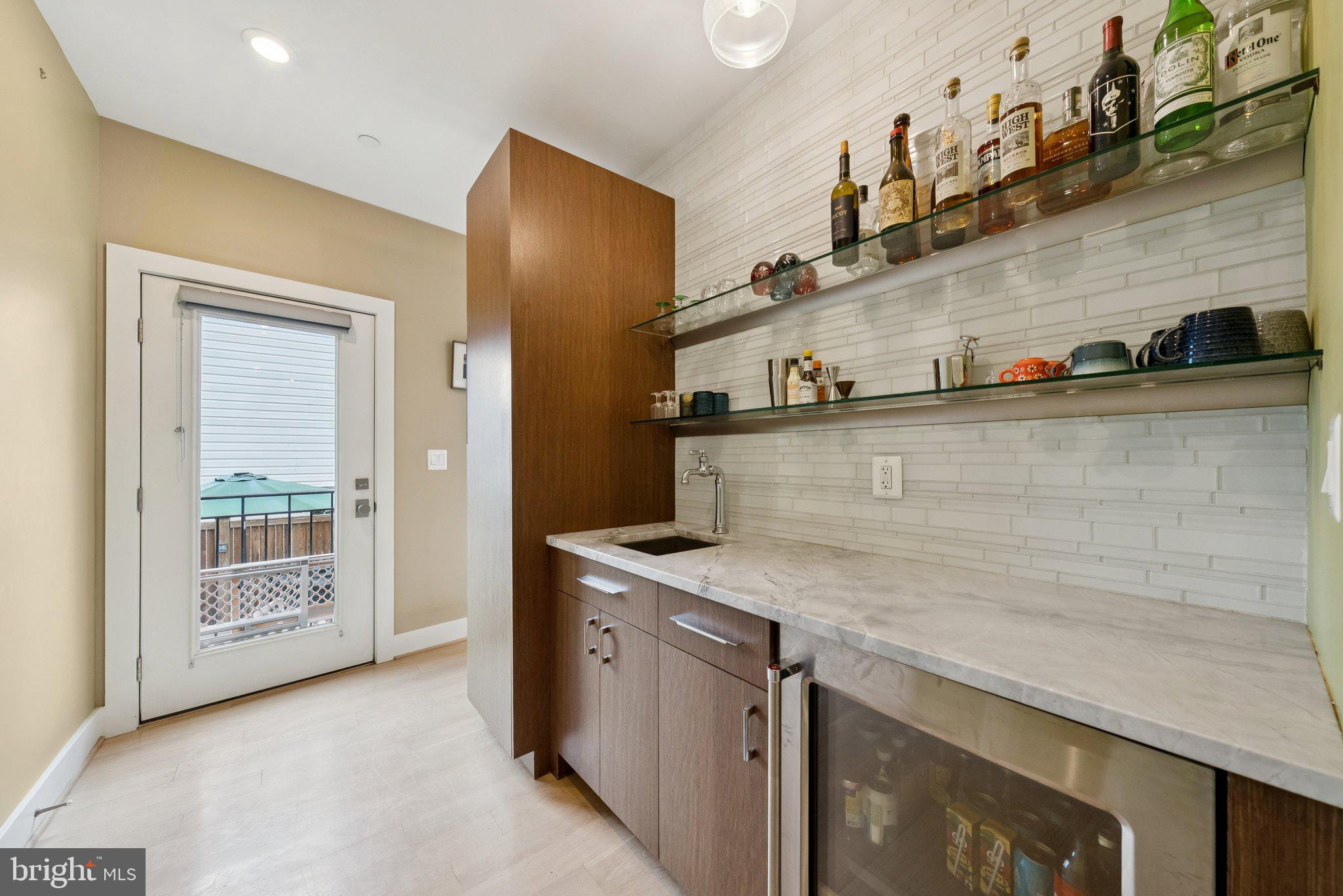 1301 Potomac Avenue Southeast, Unit 2 Washington, DC 20003 - Photo 11 of 27 a kitchen with stainless steel appliances granite countertop a sink and a stove