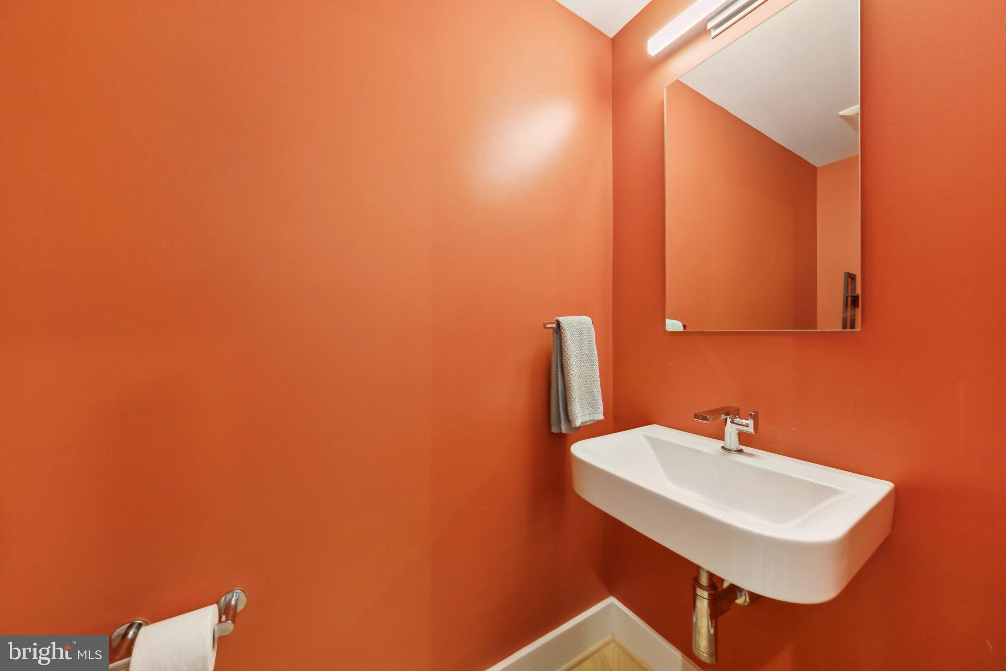 1301 Potomac Avenue Southeast, Unit 2 Washington, DC 20003 - Photo 12 of 27 a bathroom with a sink a mirror and a toilet