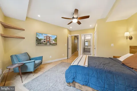 a bedroom with a bed and a couch