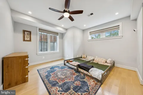 a living room with furniture and a rug