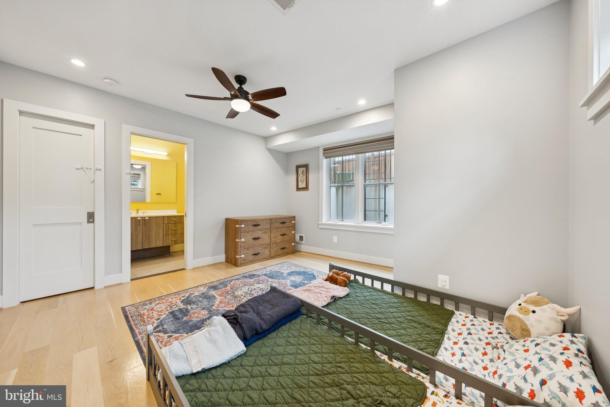 1301 Potomac Avenue Southeast, Unit 2 Washington, DC 20003 - Photo 17 of 27 a bedroom with a bed and wooden floor