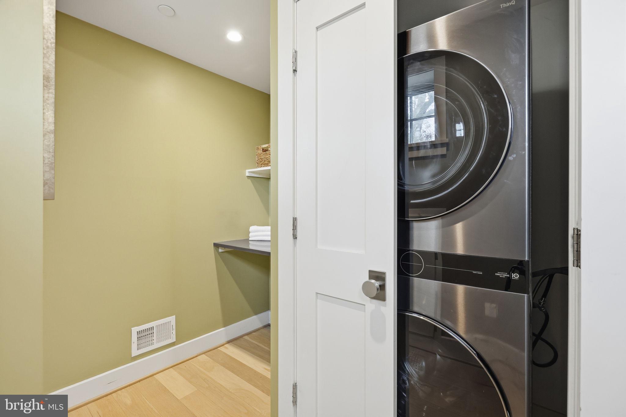 1301 Potomac Avenue Southeast, Unit 2 Washington, DC 20003 - Photo 22 of 30 a close view of a utility room with dryer and washer