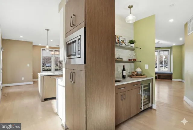 a kitchen with a refrigerator and cabinets