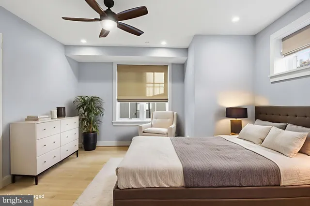 a bedroom with a bed and window