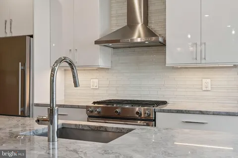 a kitchen with a sink and cabinets