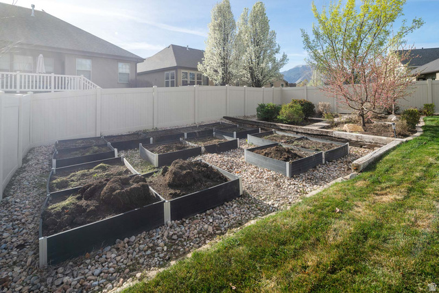 1997 West Cres Drive Mapleton, UT 84664 - Photo 34 of 35 Fenced backyard featuring a vegetable garden and a mountain view