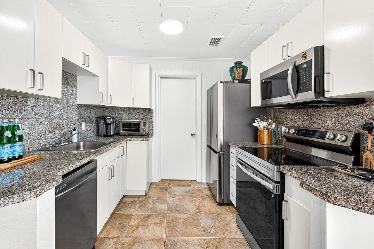 3511 Washington Road West Palm Beach, FL 33405 - Photo 36 of 47 GH-Kitchen to Bedroom