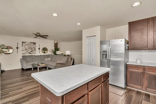a kitchen with stainless steel appliances a refrigerator and stove