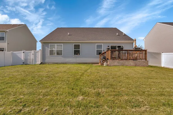 a front view of house with yard and seating area
