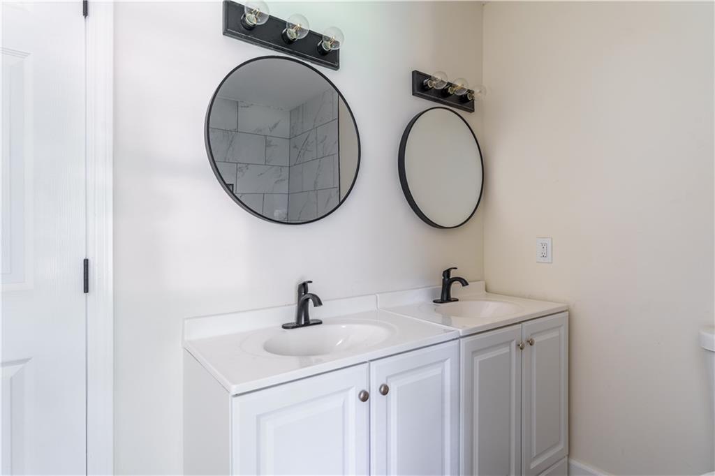1365 Campbellton Road Southwest Atlanta, GA 30310 - Photo 27 of 36 a bathroom with a sink and a mirror
