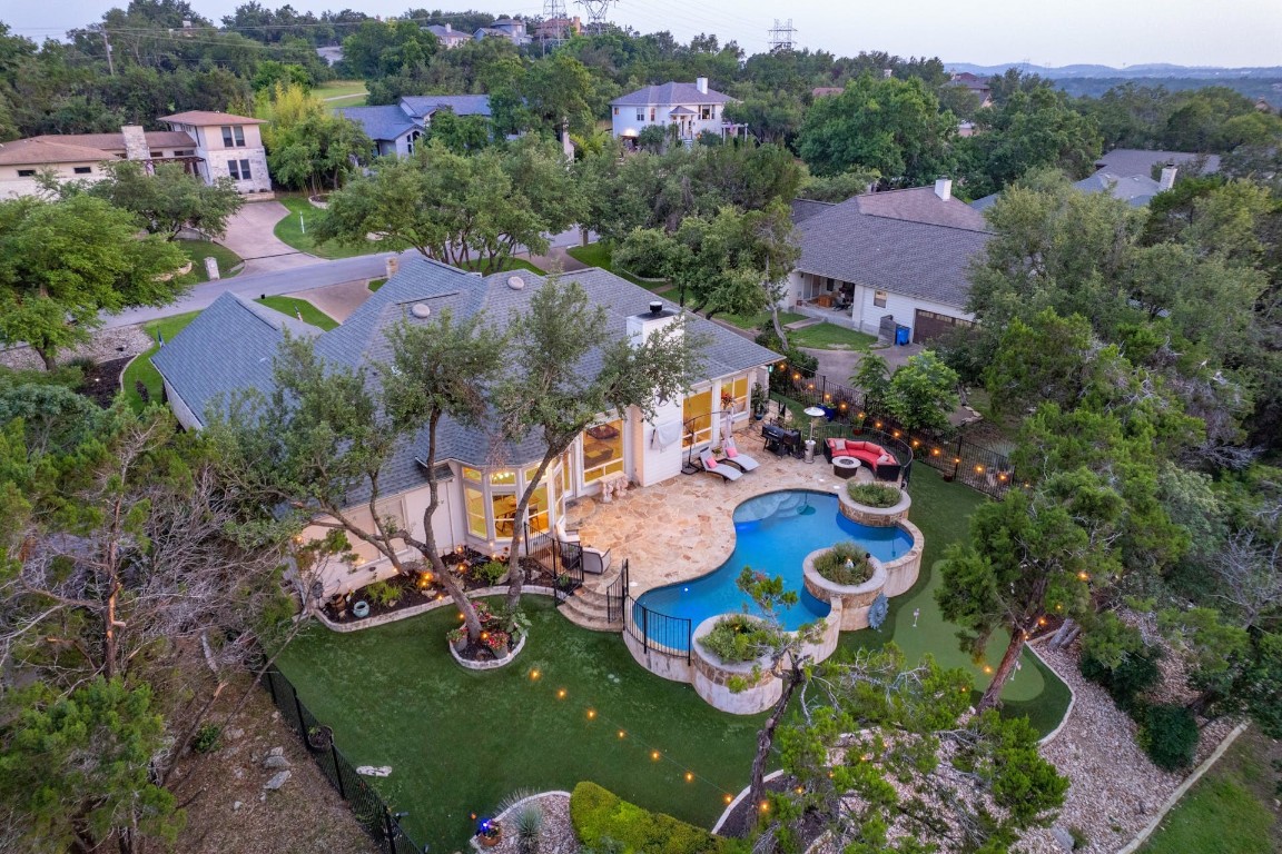 an aerial view of residential houses and outdoor space