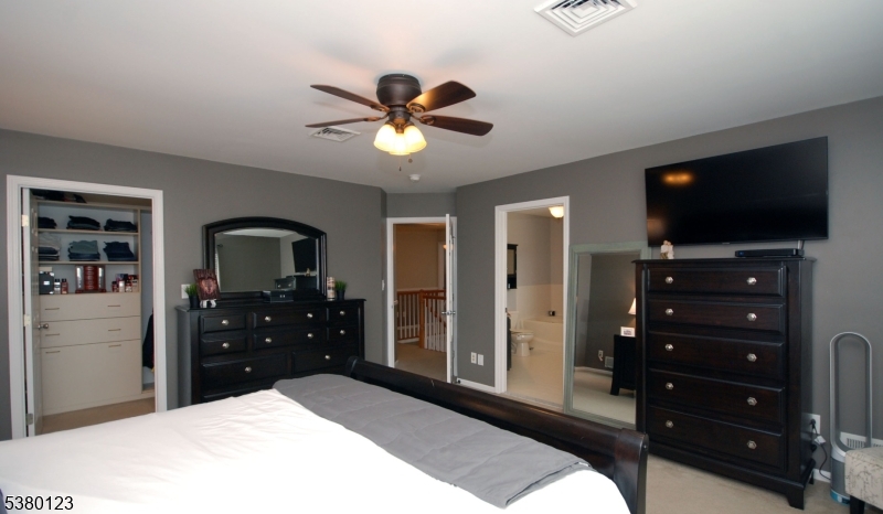 32 Peterson Road Hillsborough, NJ 08844 - Photo 18 of 38 a bedroom with a bed and a flat screen tv