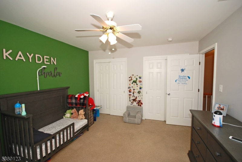 32 Peterson Road Hillsborough, NJ 08844 - Photo 23 of 38 a bedroom with a bed and a chandelier