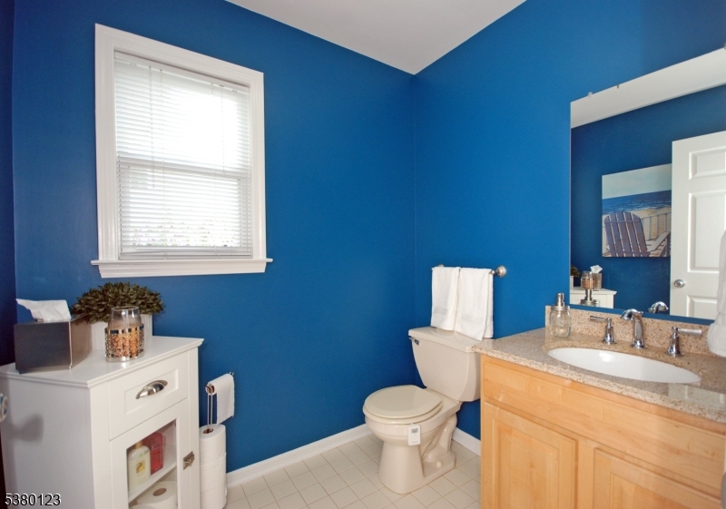 32 Peterson Road Hillsborough, NJ 08844 - Photo 27 of 38 a bathroom with a toilet a sink and a window