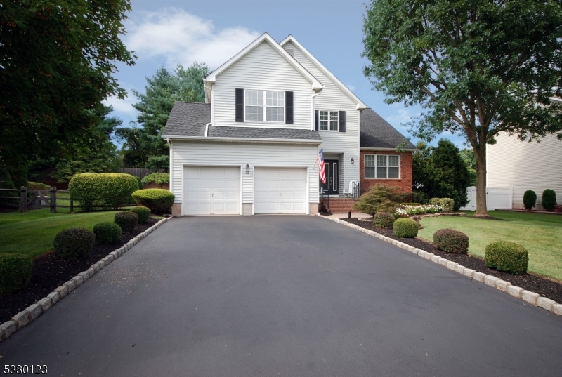 32 Peterson Road Hillsborough, NJ 08844 - Photo 37 of 38 a front view of a house with a yard and garage