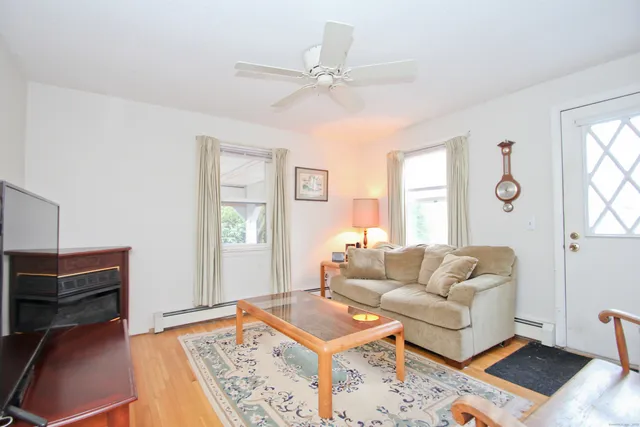 a living room with furniture and a window
