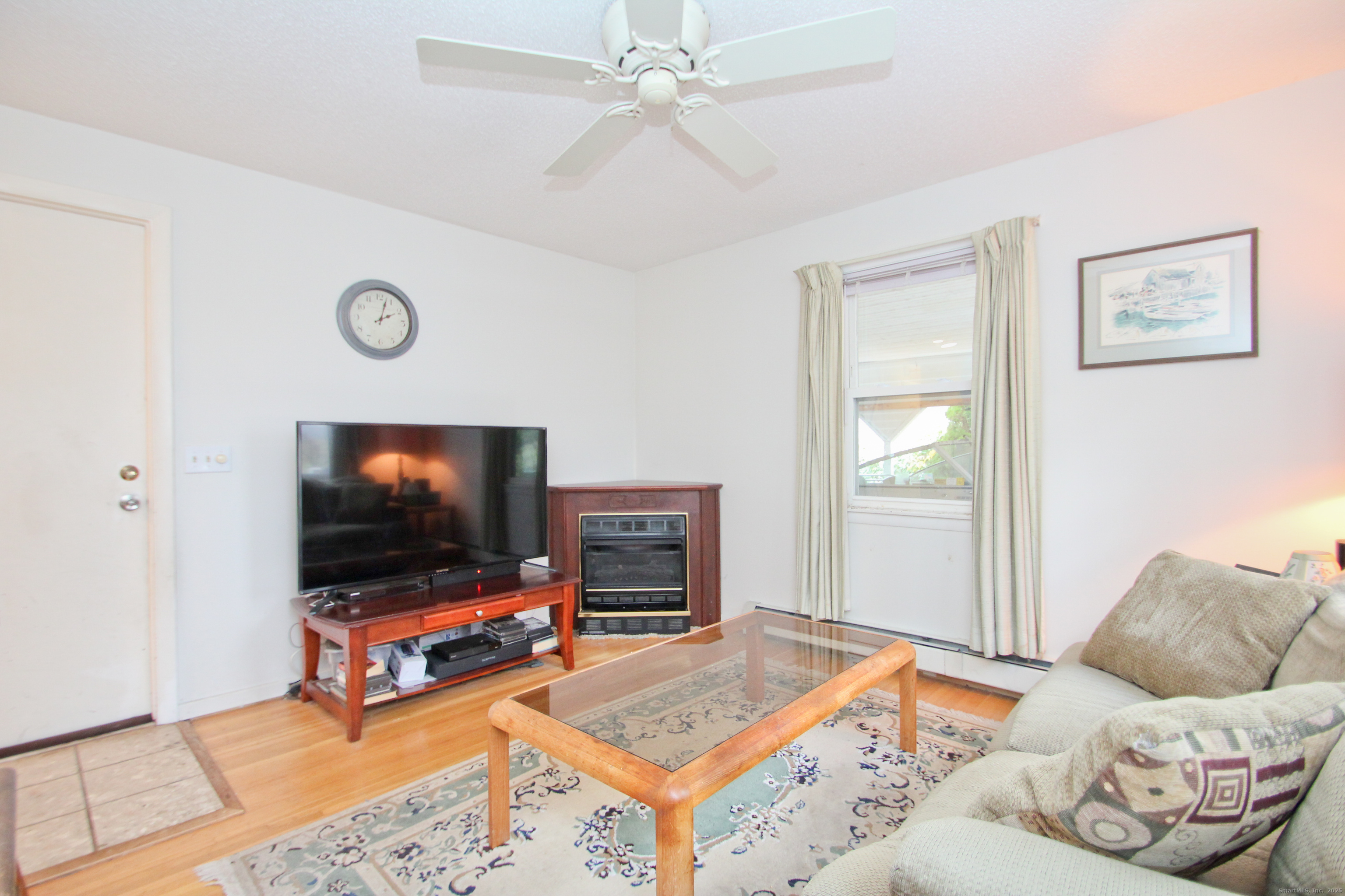 11 Northfield Road Enfield, CT 06082 - Photo 17 of 34 a living room with furniture and a flat screen tv