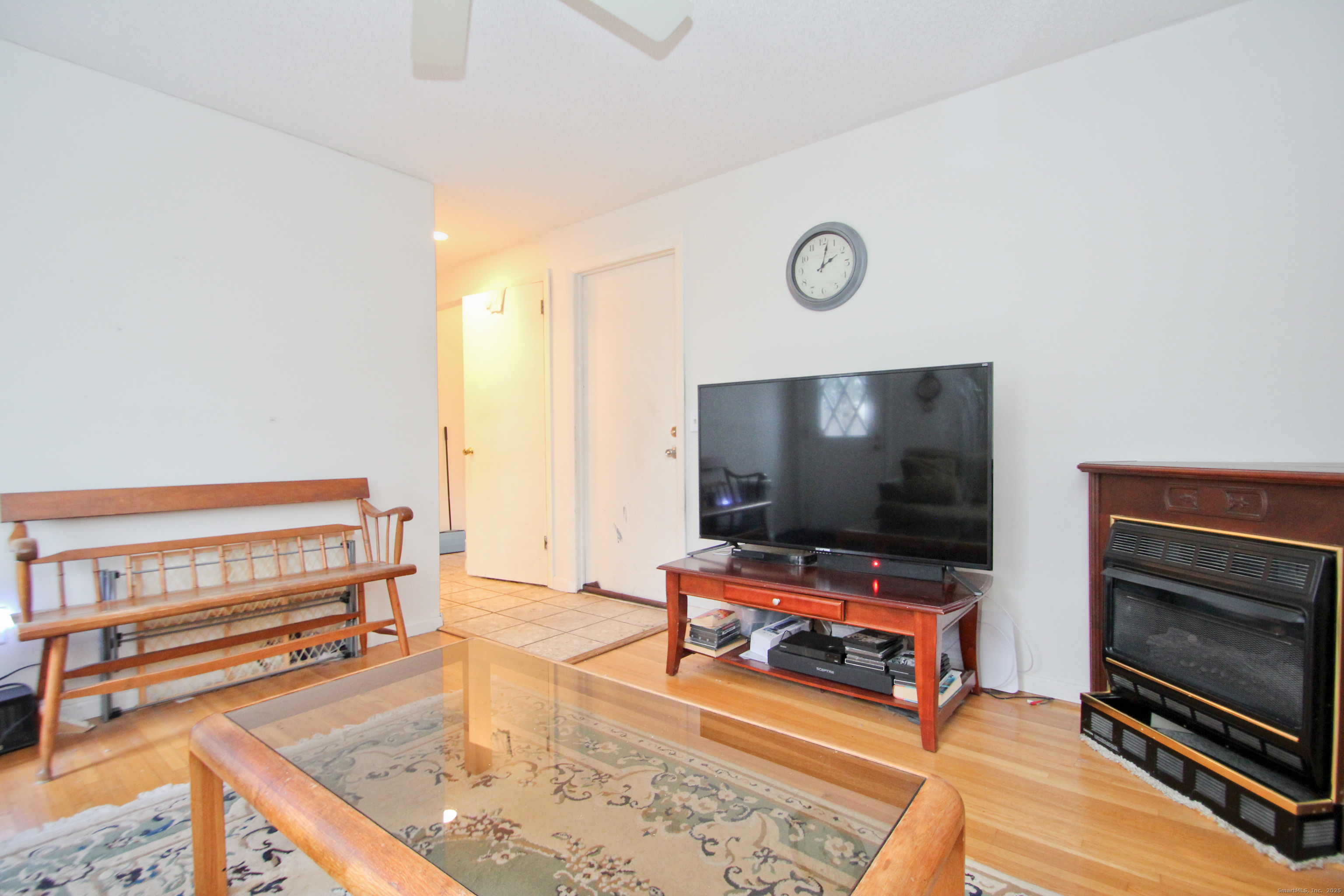 11 Northfield Road Enfield, CT 06082 - Photo 18 of 34 a living room with furniture and a flat screen tv
