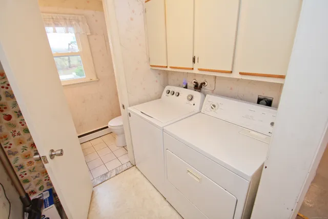 a utility room with dryer and washer