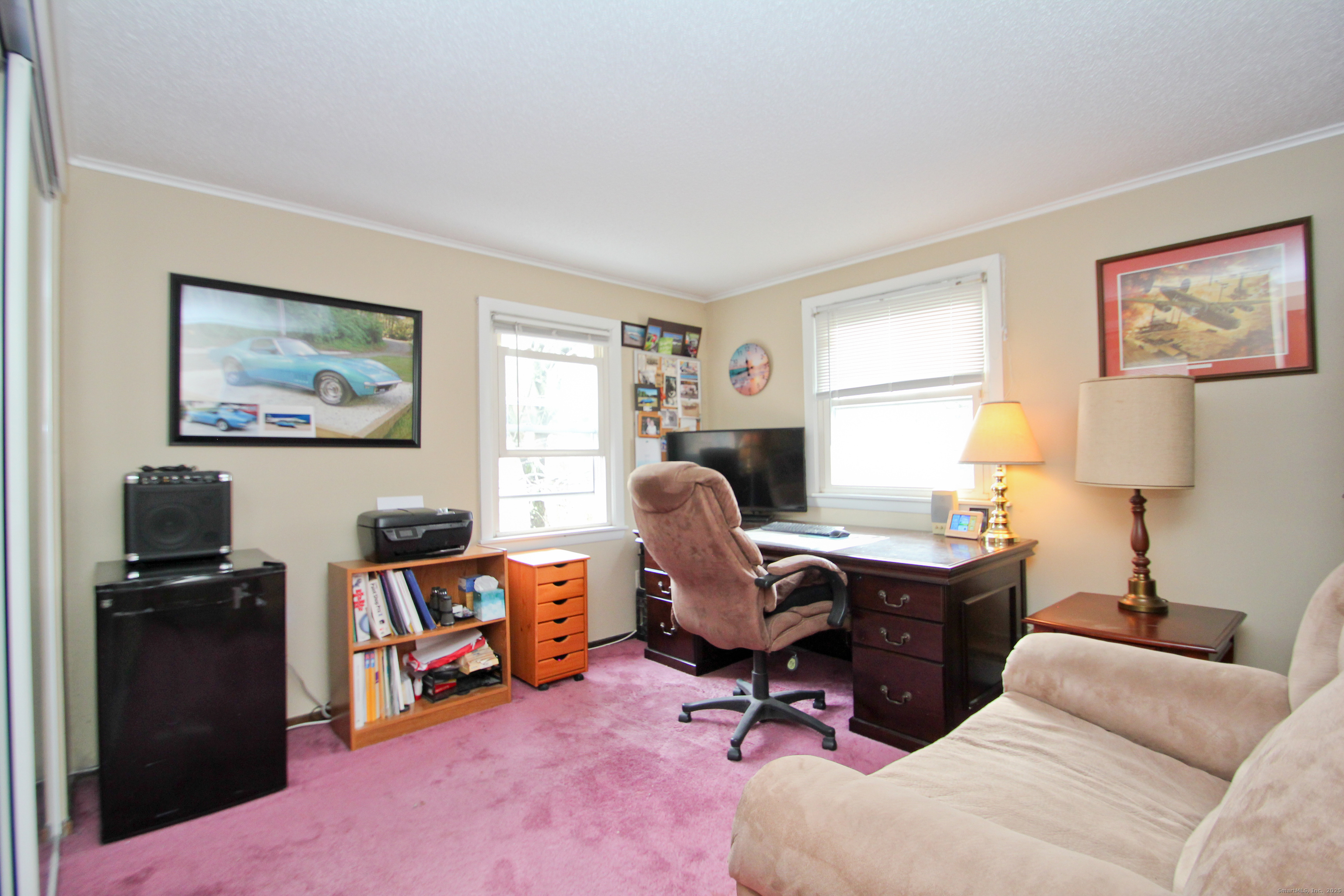11 Northfield Road Enfield, CT 06082 - Photo 24 of 34 a view of a workspace with a window and lounge chair