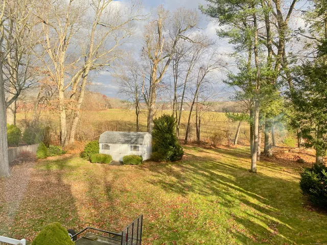 a view of a car parked in front of a house